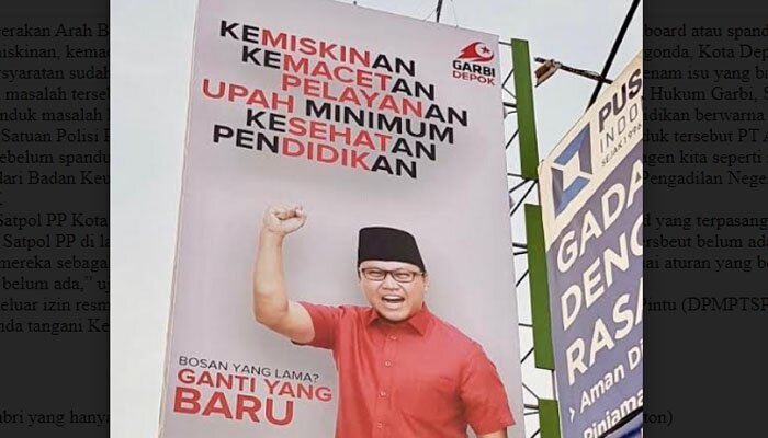 Baliho Garbi yang hanya berusia kurang dari 24 jam langsung diturunkan Satpol PP Depok. (anton)